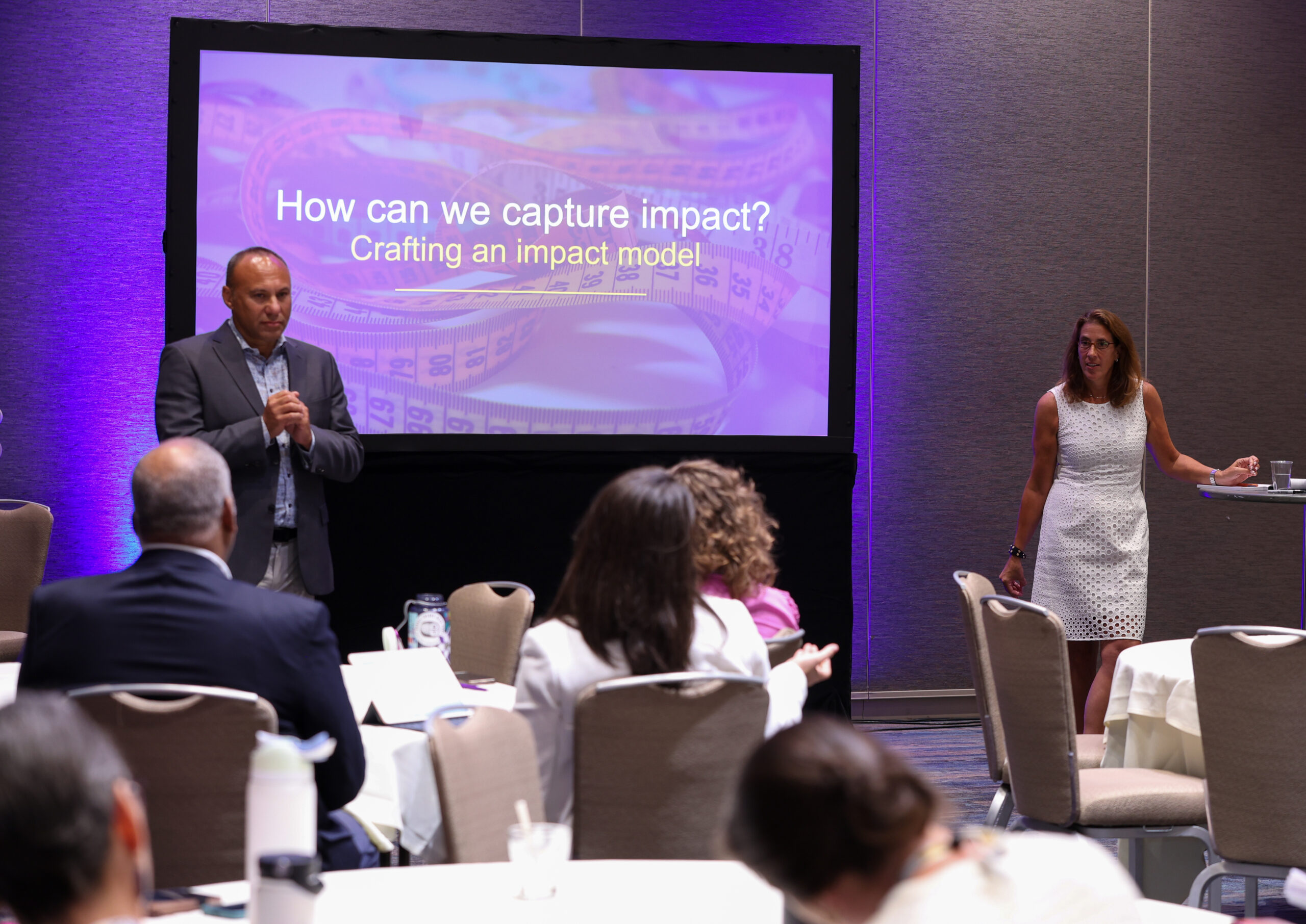 Nikki Korn and Mark Feldman making a presentation at a conference